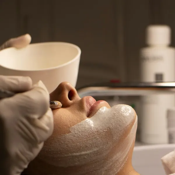 Client receiving a facial mask treatment